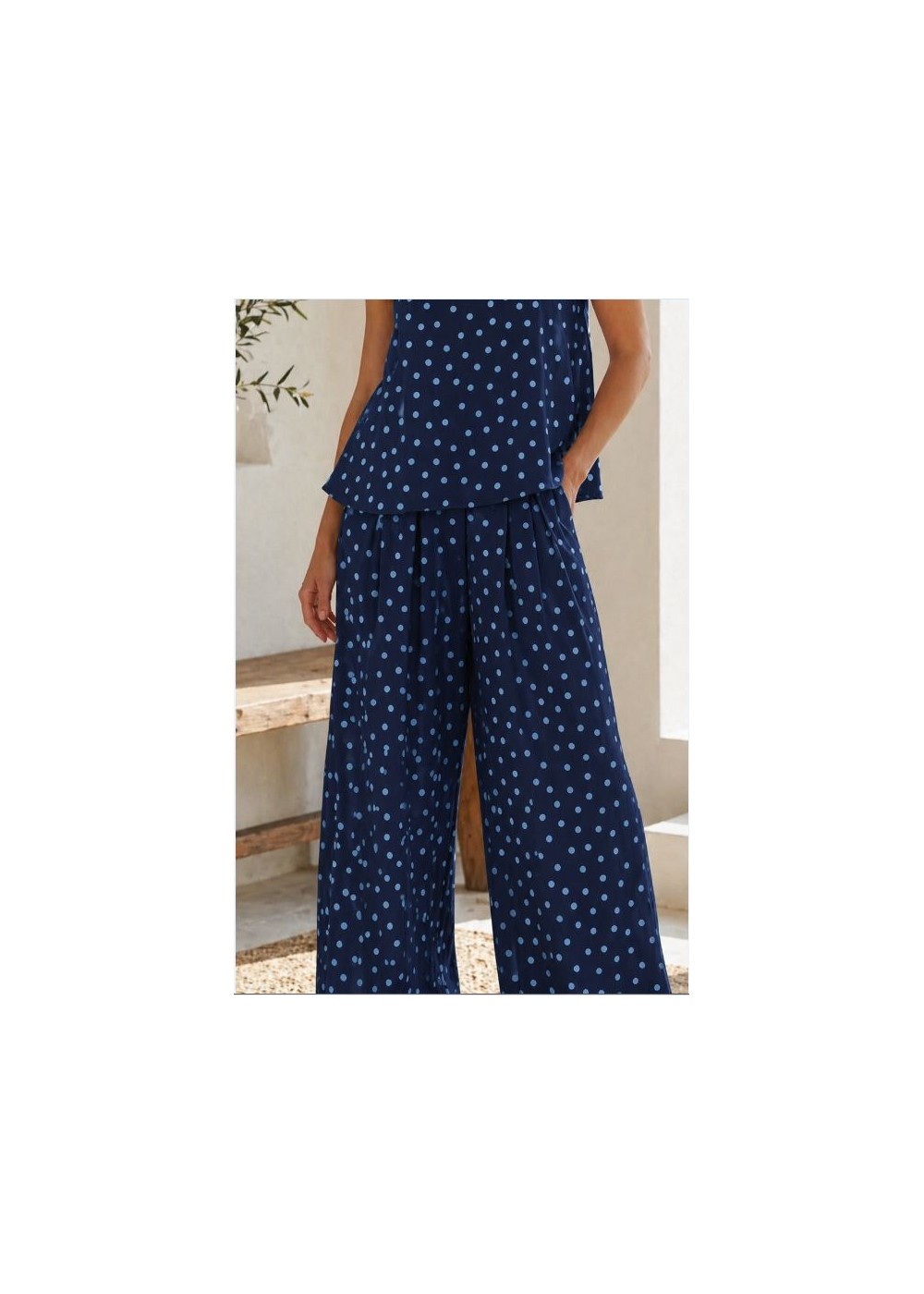 Pantalón ancho goma cintura y bolsillos lunares azules