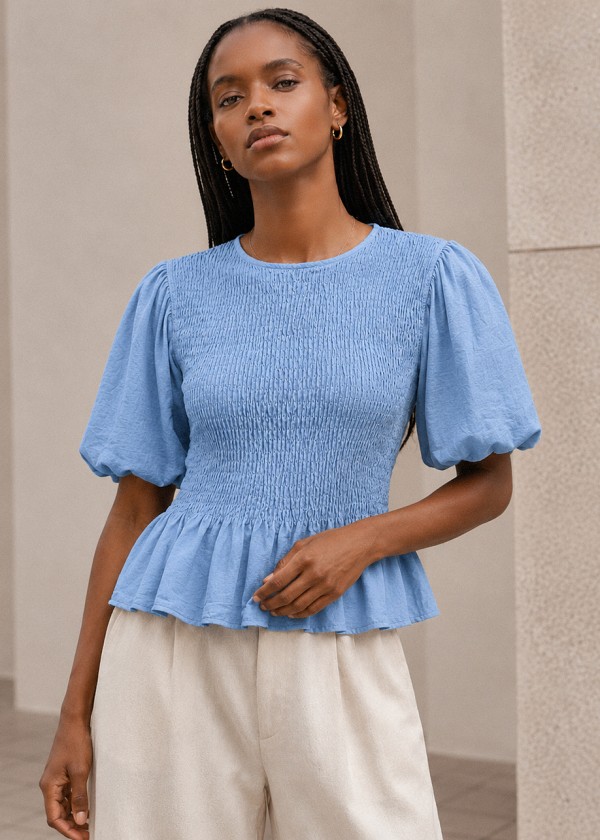 Blusa nido de abeja manga abullonada azul celeste