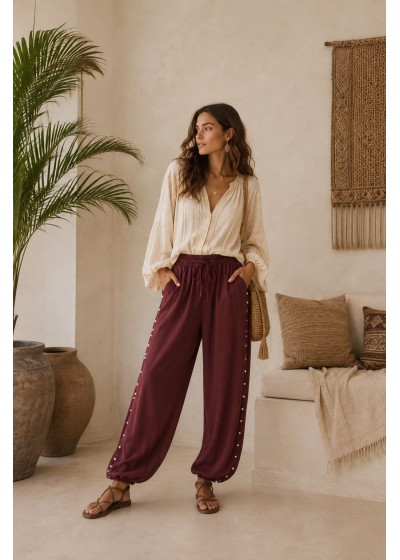 Pantalon tachas laterales