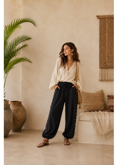 Pantalon tachas laterales